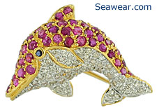 18kt dolphin with diamonds, rubies and sapphire
