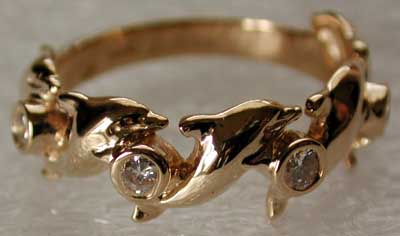 gold and diamonds dolphin ring