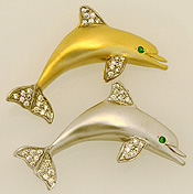 dolphin pendant with emerald eyes and .25cts of diamonds
