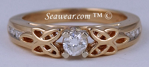 yellow gold Irish love knot engagement ring with 1/4ct diamond and Claddagh heart prongs