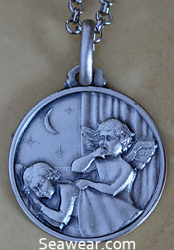 Angel watching over sleeping child medal